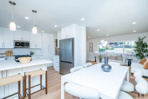 a view of a patio with couches chairs and a yard