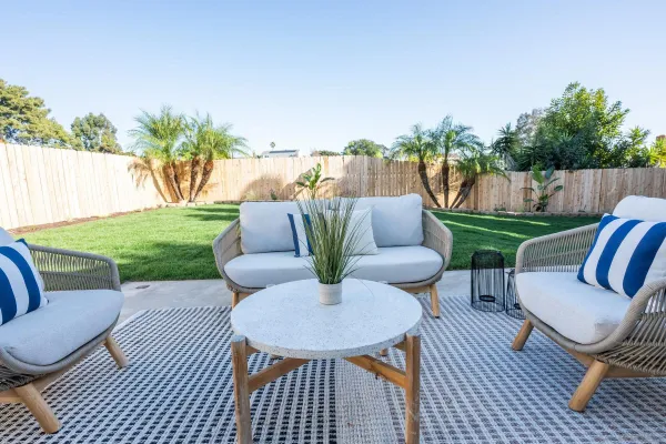 a living room with furniture a fireplace and a table