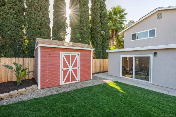 a living room with fireplace furniture and a wooden floor