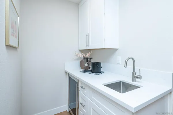 a spacious bedroom with a bed and a couch