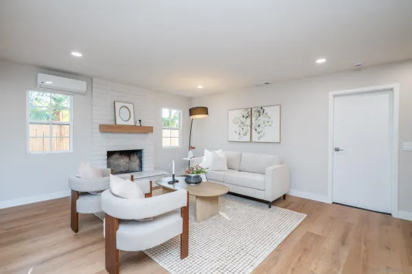 a view of a balcony with floor to ceiling windows and tree
