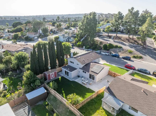 an aerial view of a house with a swimming pool
