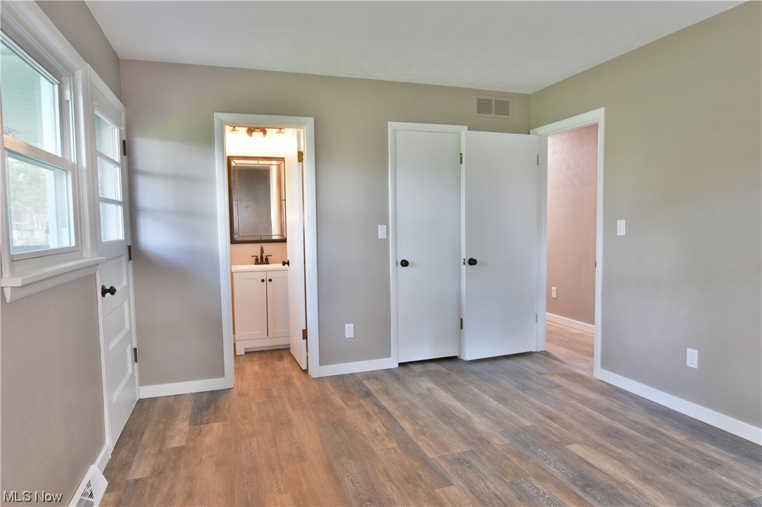 5480 Phillips Rice Road Cortland, OH 44410 - Photo 21 of 35 Bedroom with light hardwood flooring