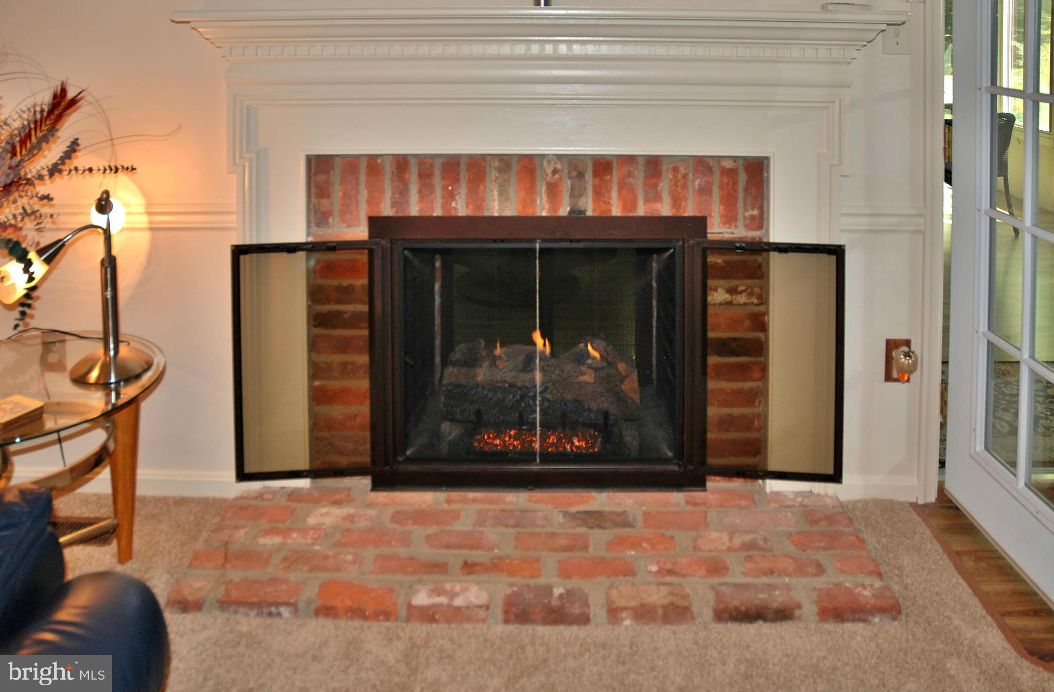 13809 Turnmore Road Silver Spring, MD 20906 - Photo 13 of 28 Family Room With Double Sided Gas Fireplace