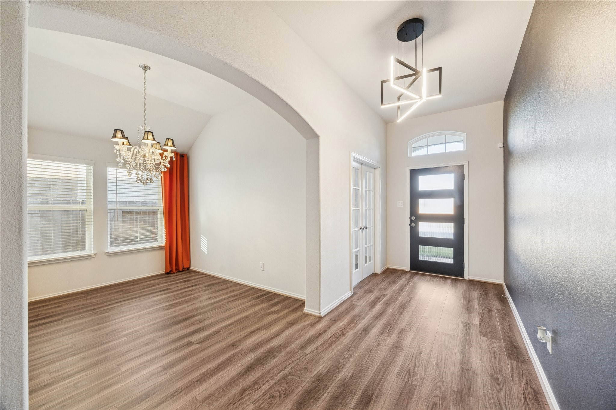 10318 Muir Bend Drive Rosharon, TX 77583 - Photo 3 of 10 a view of a room with wooden floor and a window