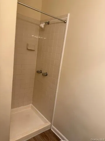 a view of a room window and wooden floor