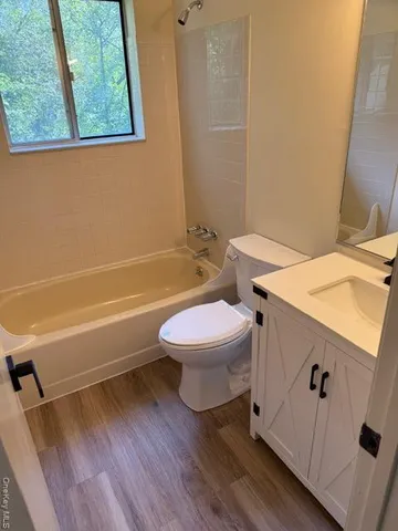 a bathroom with a toilet a sink and a bathtub