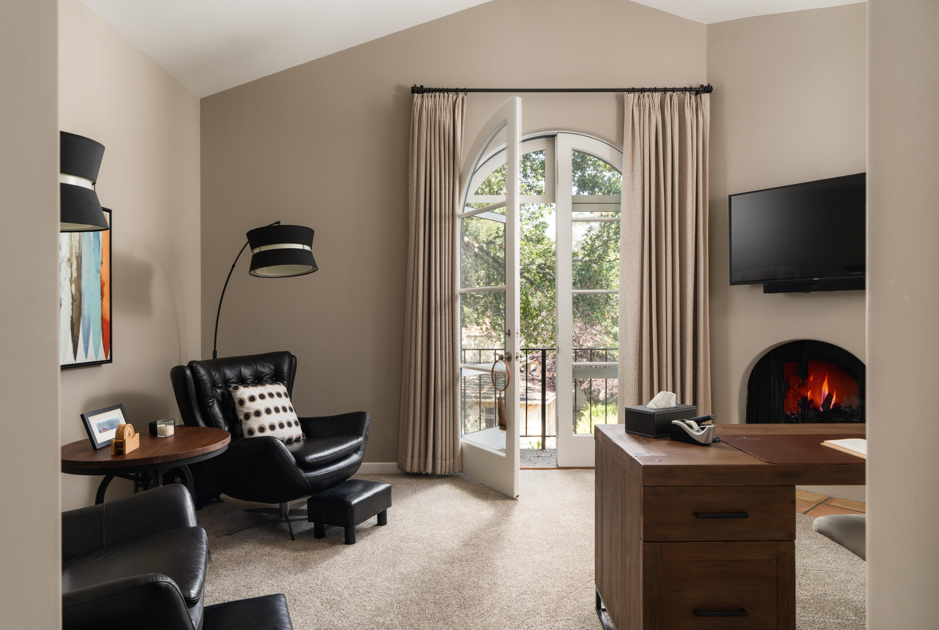 485 Monarch Lane Montecito, CA 93108 - Photo 16 of 28 a living room with furniture a flat screen tv and a fireplace
