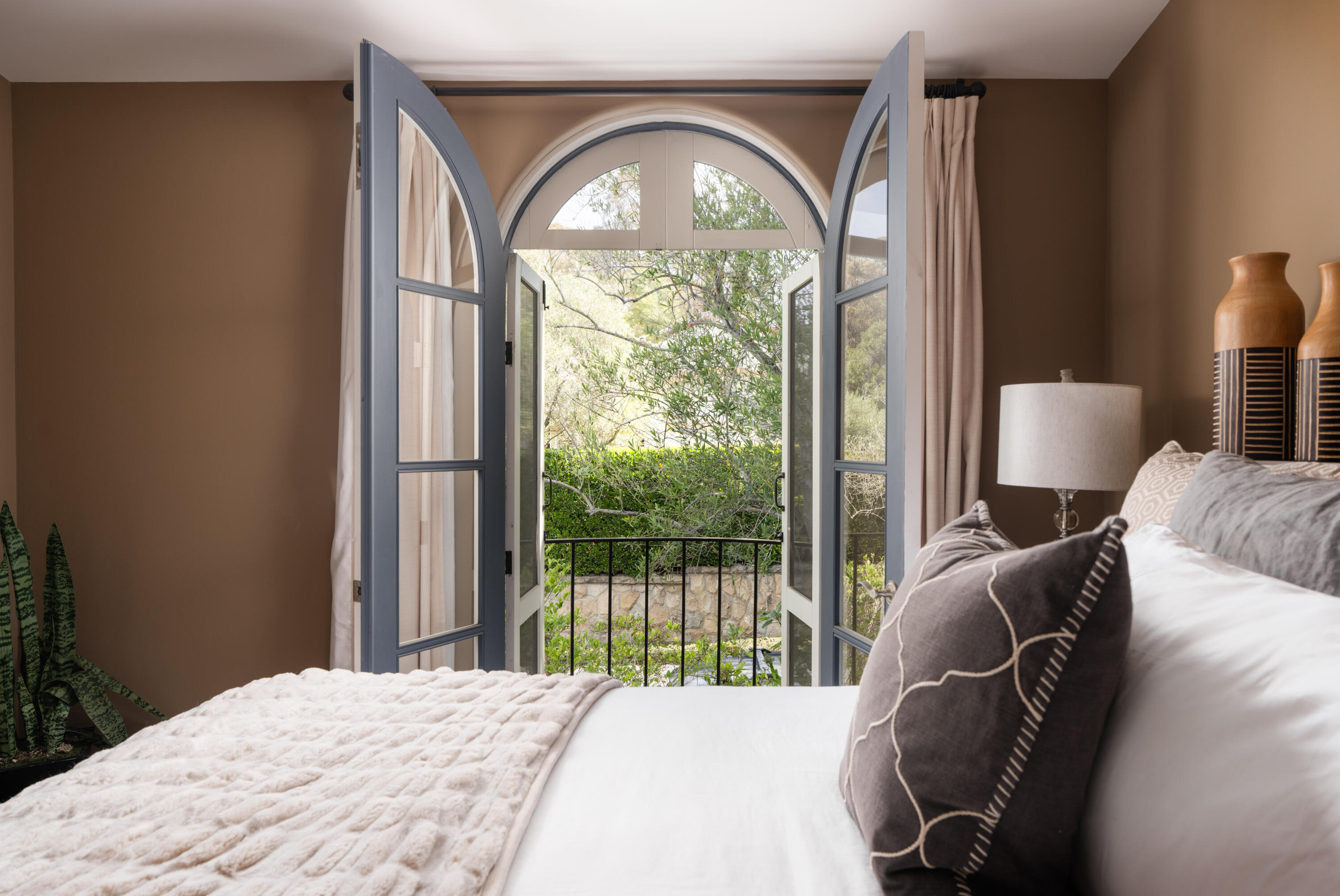 485 Monarch Lane Montecito, CA 93108 - Photo 19 of 28 a bedroom with a bed and a large window