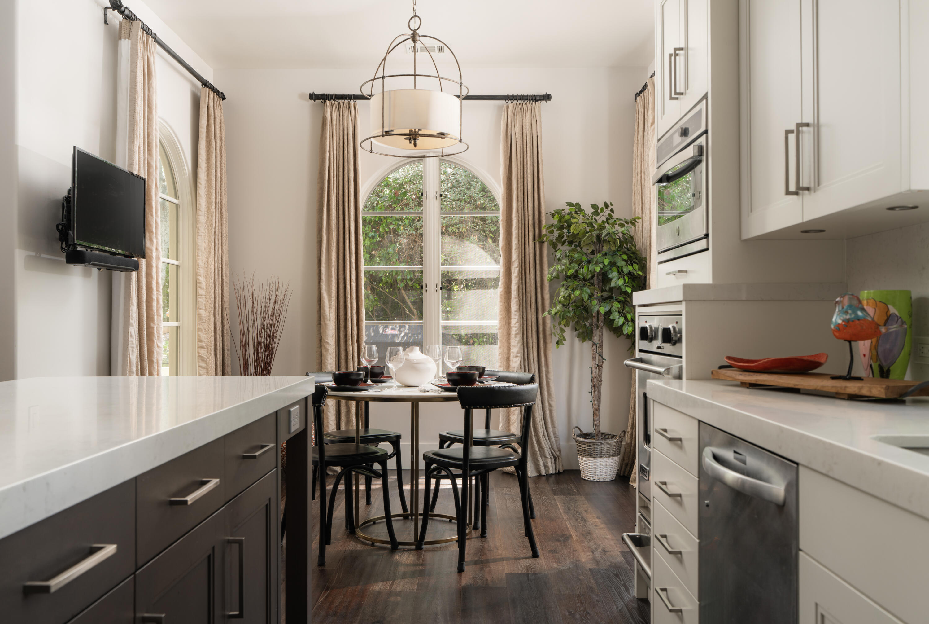 485 Monarch Lane Montecito, CA 93108 - Photo 9 of 28 a kitchen with stainless steel appliances a table and chairs in it