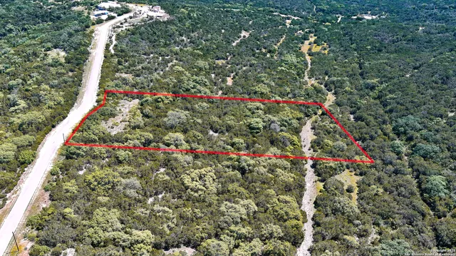 a view of a field with an ocean