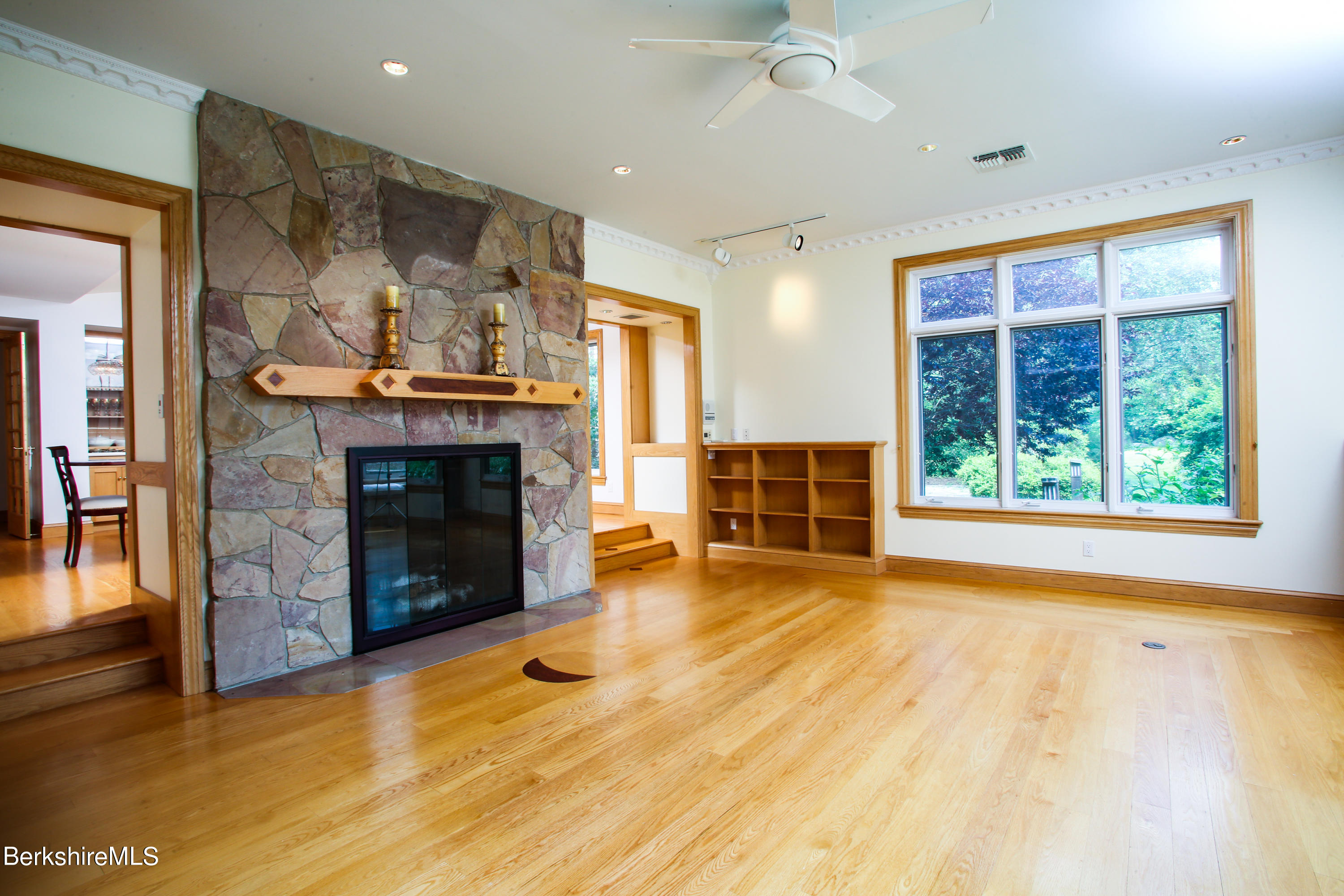 16 High Meadow Road Northampton, MA 01062 - Photo 13 of 49 an empty room with wooden floor fireplace and windows