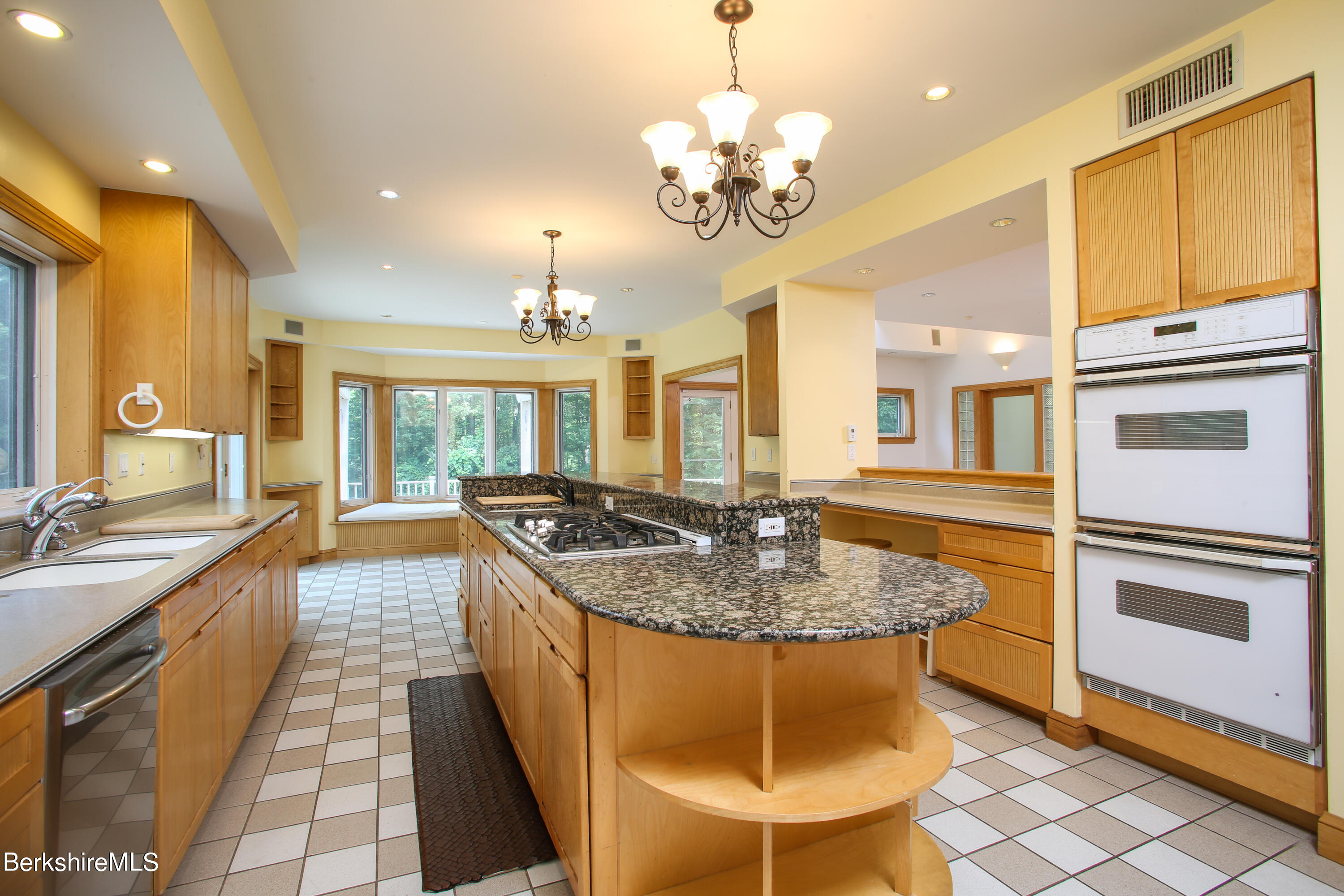 16 High Meadow Road Northampton, MA 01062 - Photo 3 of 49 a large kitchen with kitchen island a chandelier