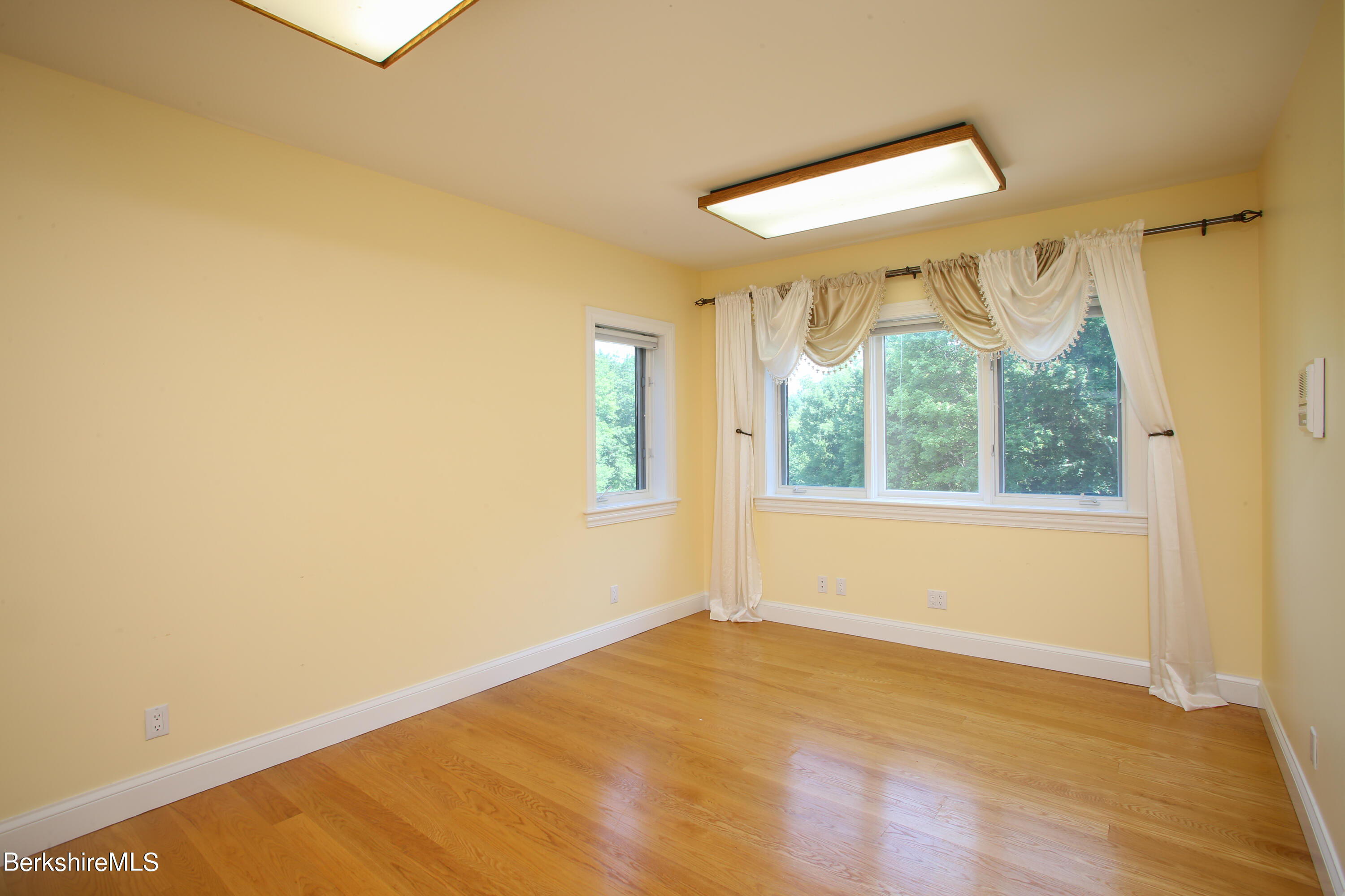16 High Meadow Road Northampton, MA 01062 - Photo 28 of 49 a view of empty room with wooden floor and fan