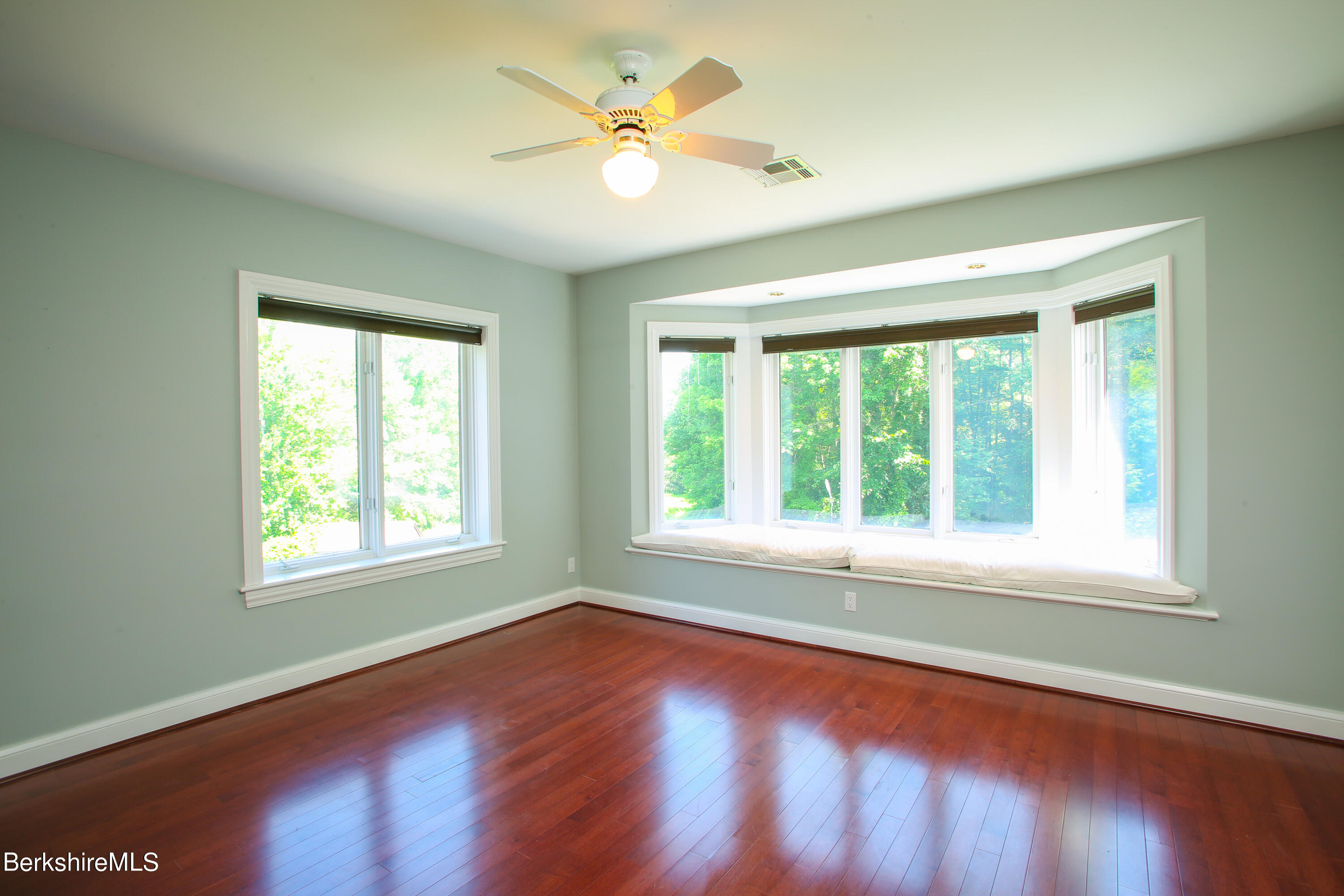 16 High Meadow Road Northampton, MA 01062 - Photo 29 of 49 an empty room with wooden floor and windows
