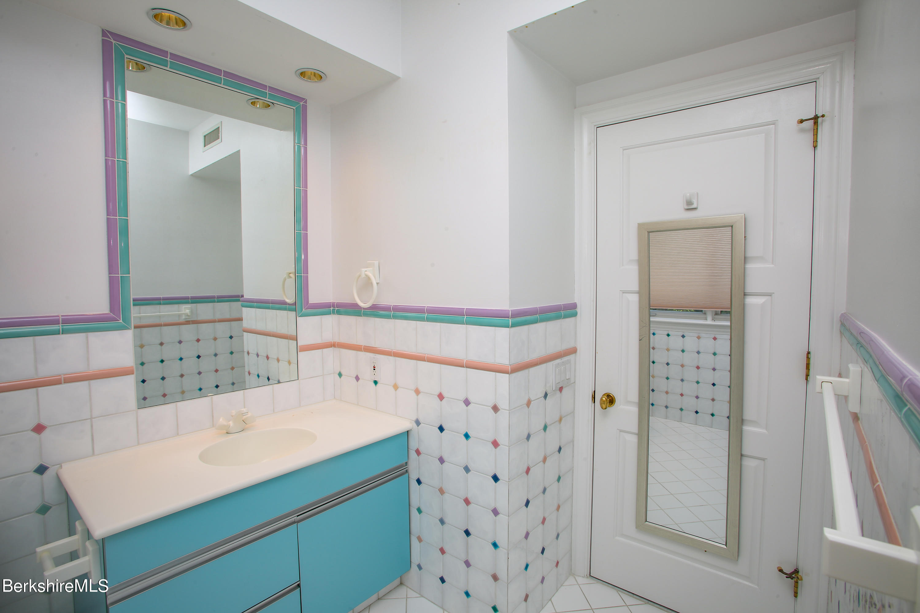 16 High Meadow Road Northampton, MA 01062 - Photo 30 of 49 a bathroom with a shower sink and mirror