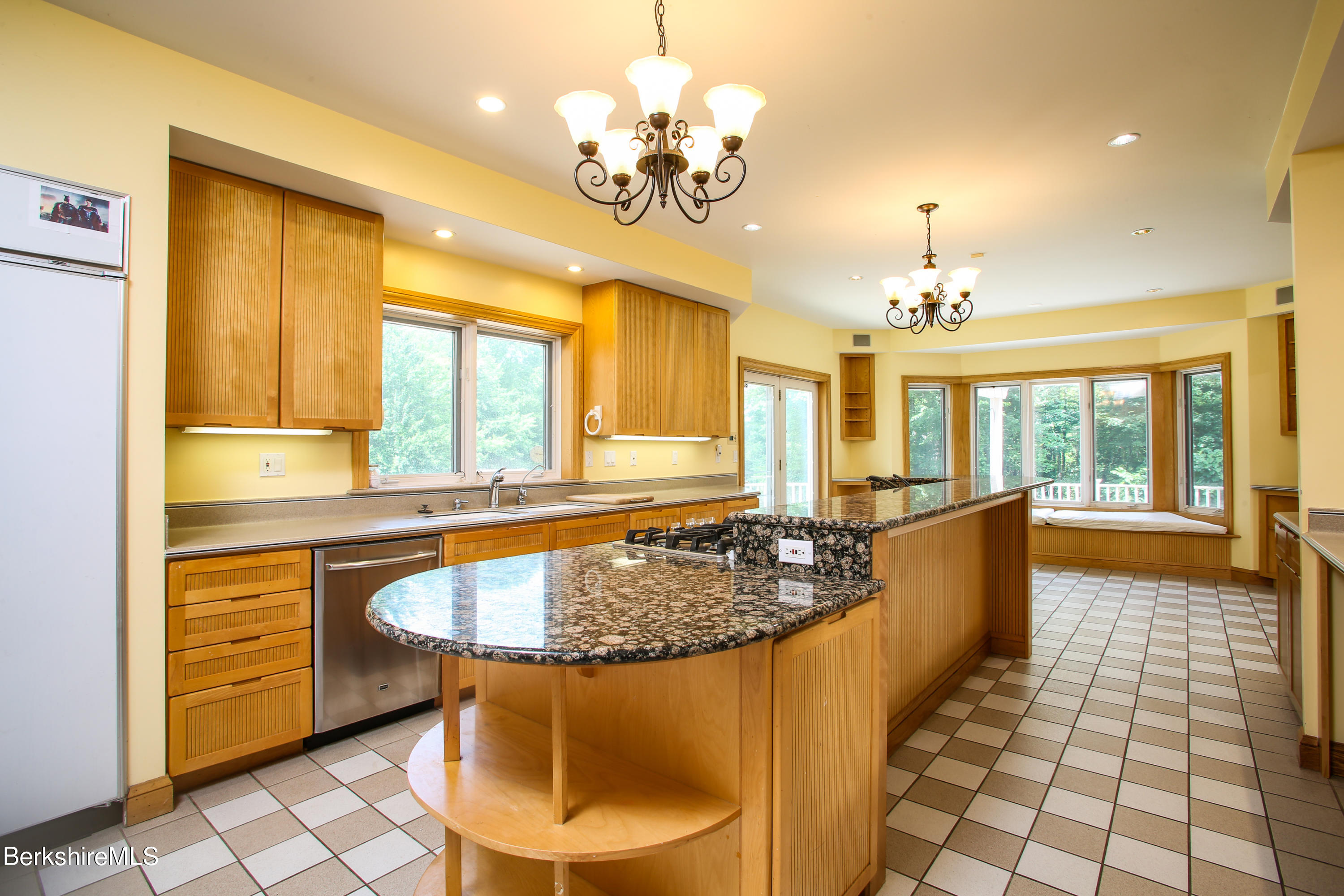 16 High Meadow Road Northampton, MA 01062 - Photo 4 of 49 a large center dining table with a chandelier