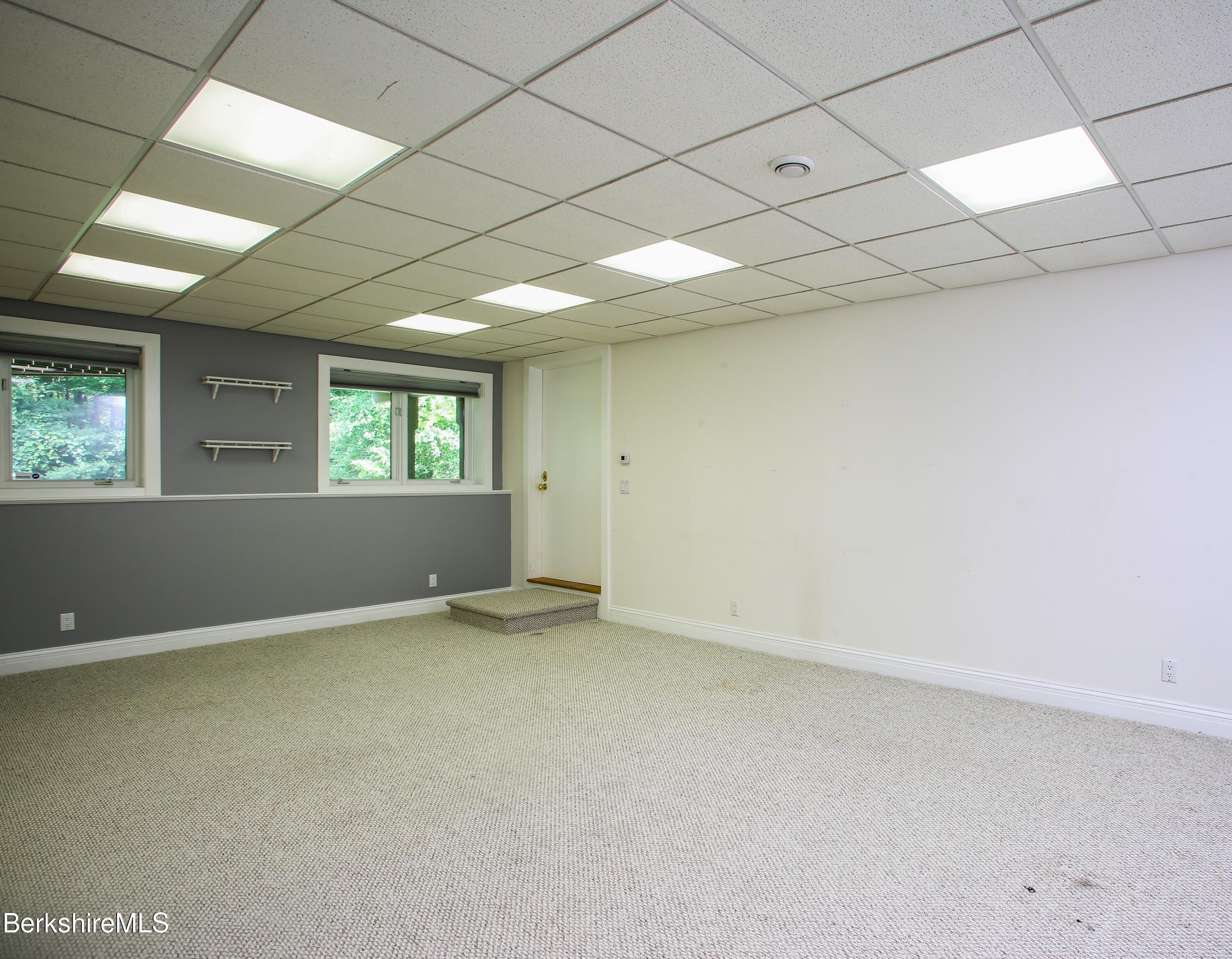16 High Meadow Road Northampton, MA 01062 - Photo 38 of 49 an empty room with a empty space and windows