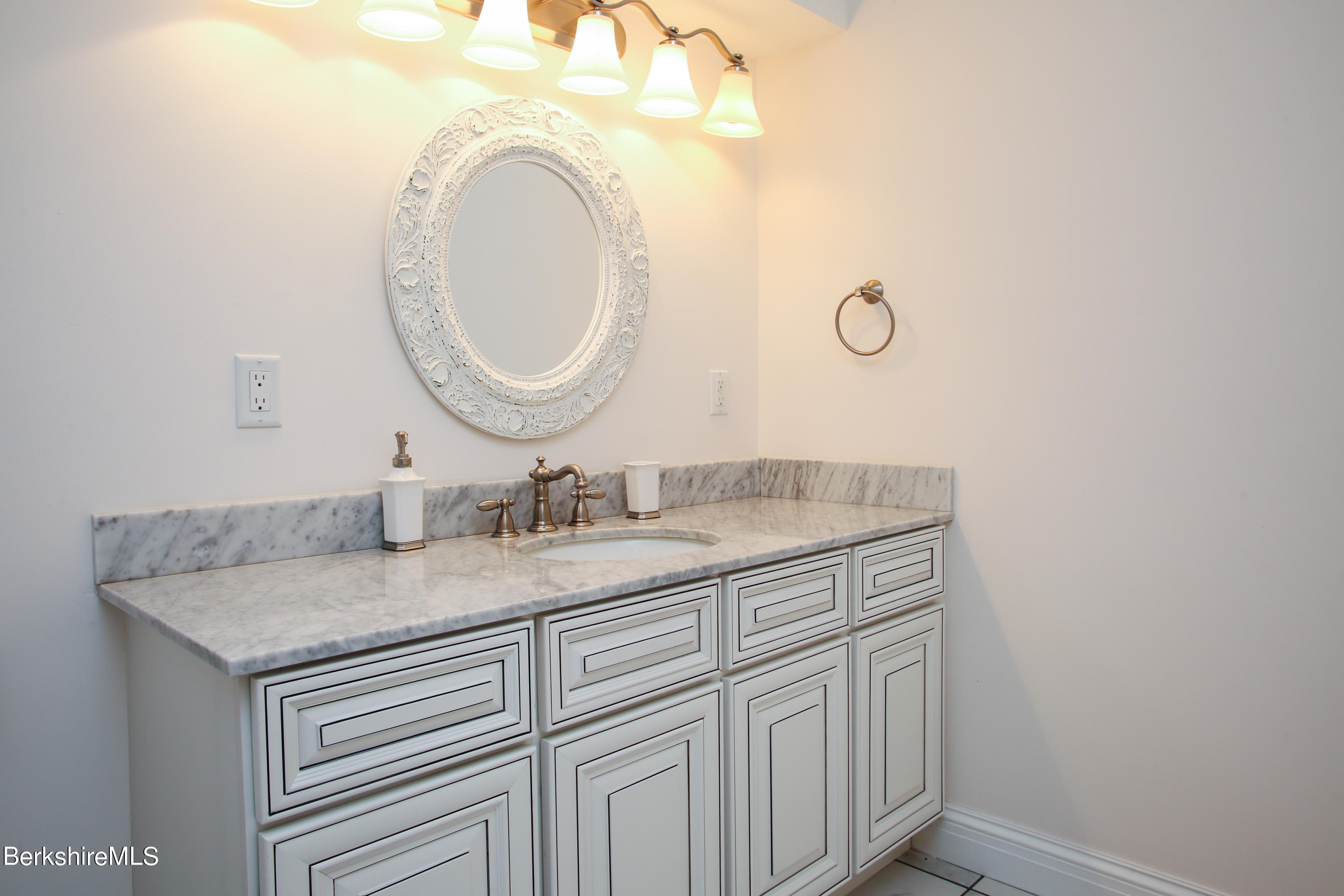 16 High Meadow Road Northampton, MA 01062 - Photo 40 of 49 a bathroom with a granite countertop double vanity sink and a mirror