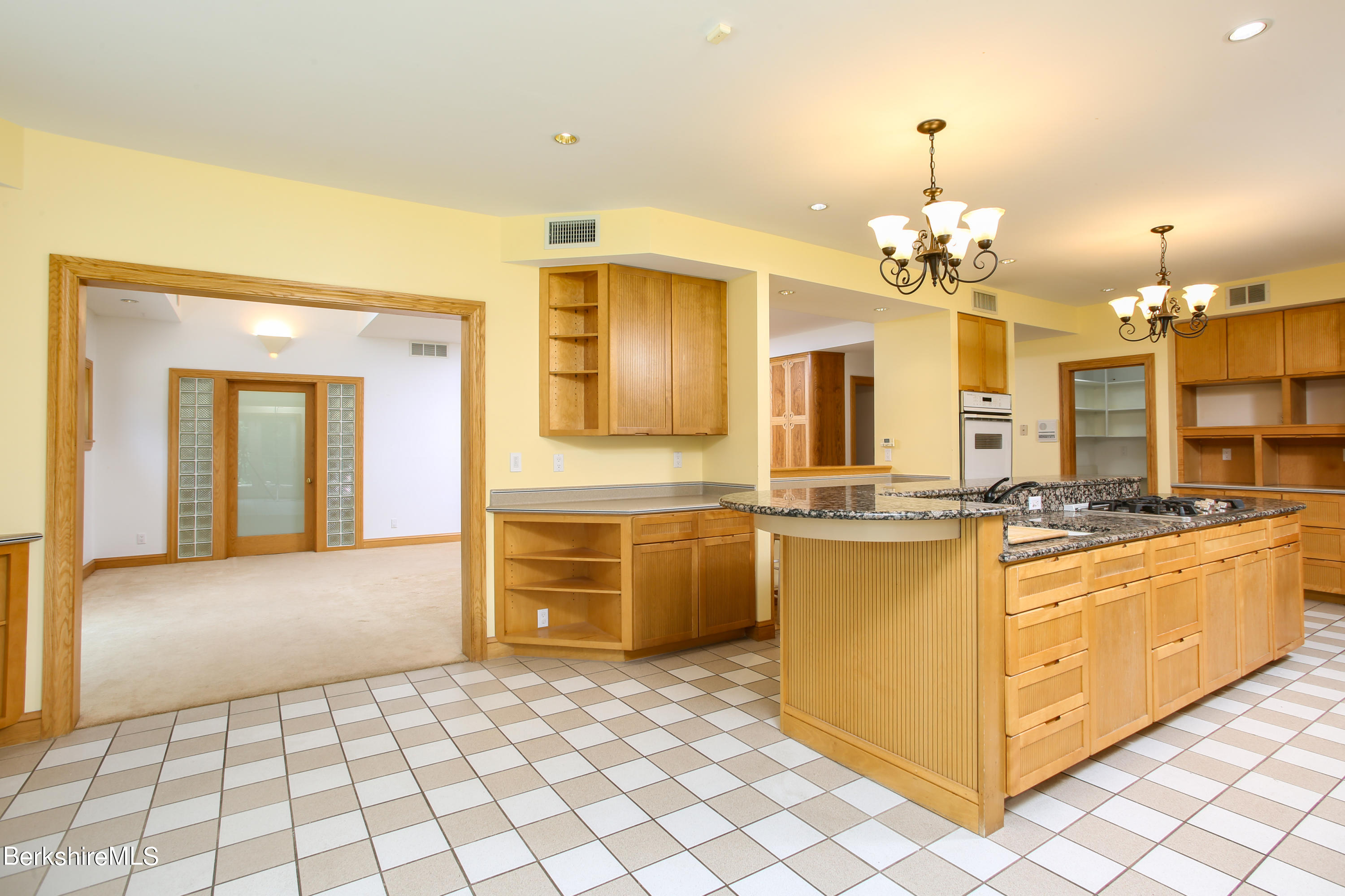 16 High Meadow Road Northampton, MA 01062 - Photo 5 of 49 a large kitchen with kitchen island granite countertop a stove and a sink