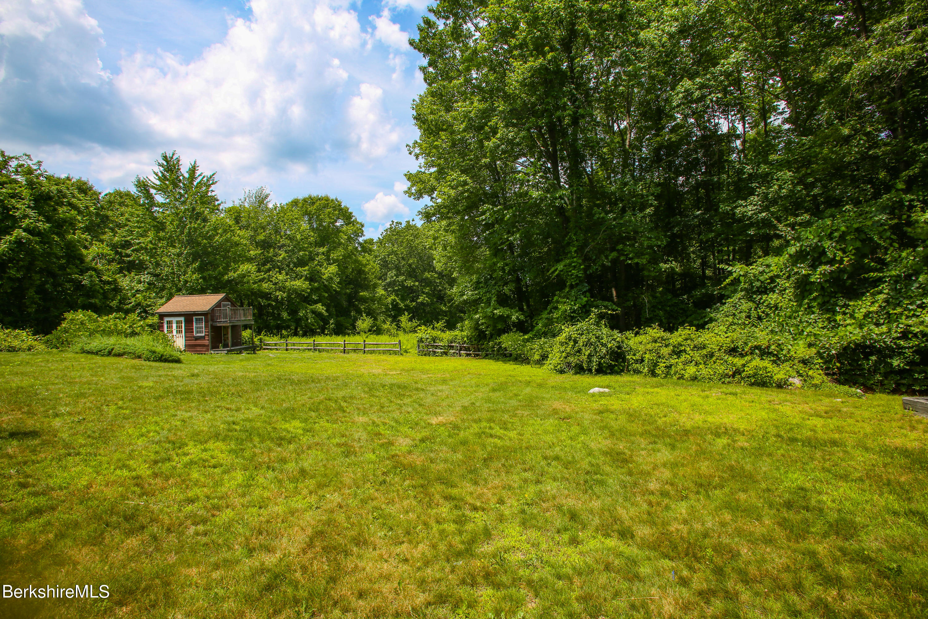 16 High Meadow Road Northampton, MA 01062 - Photo 41 of 49 a view of a garden with a fountain