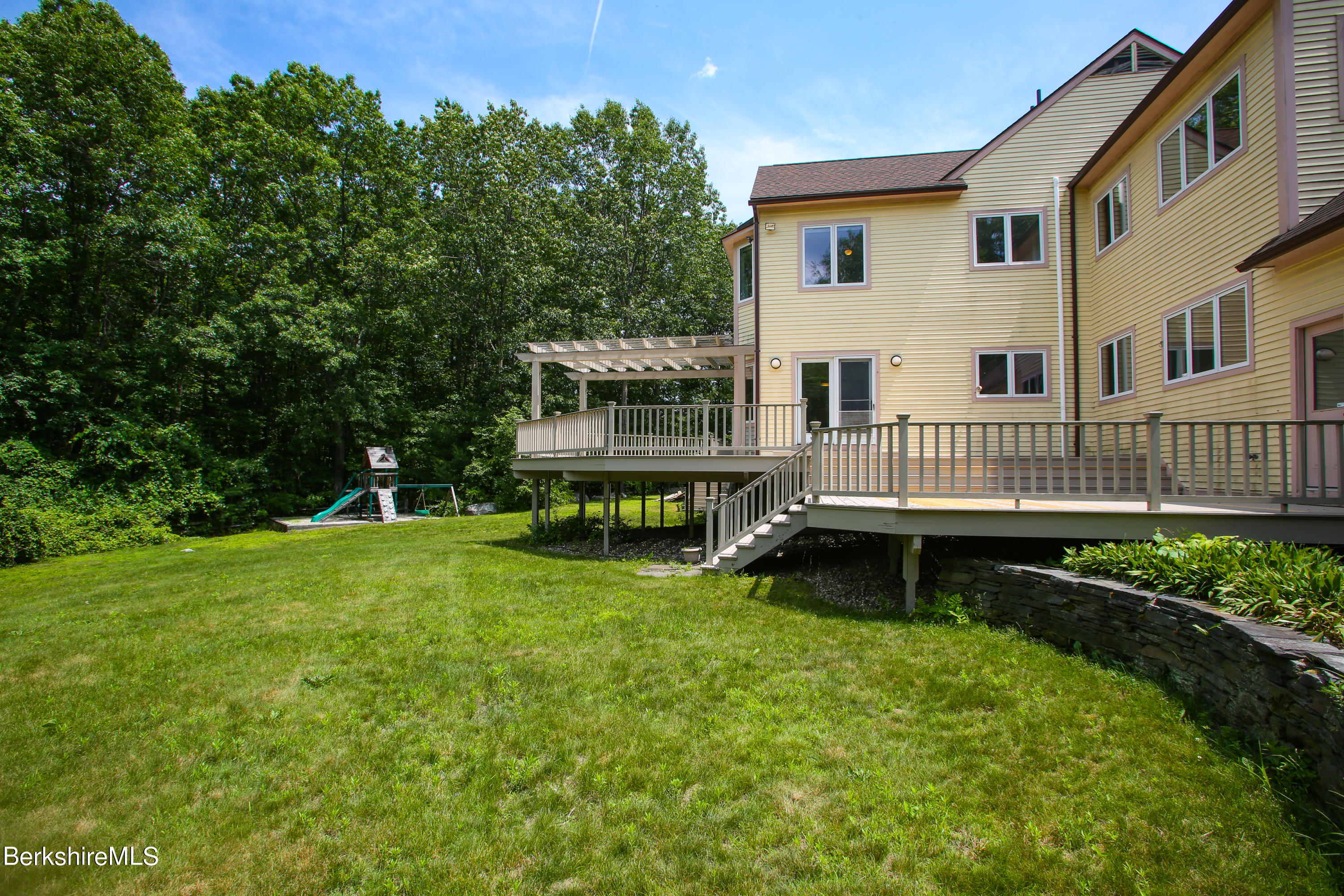 16 High Meadow Road Northampton, MA 01062 - Photo 42 of 49 a view of house with yard and deck