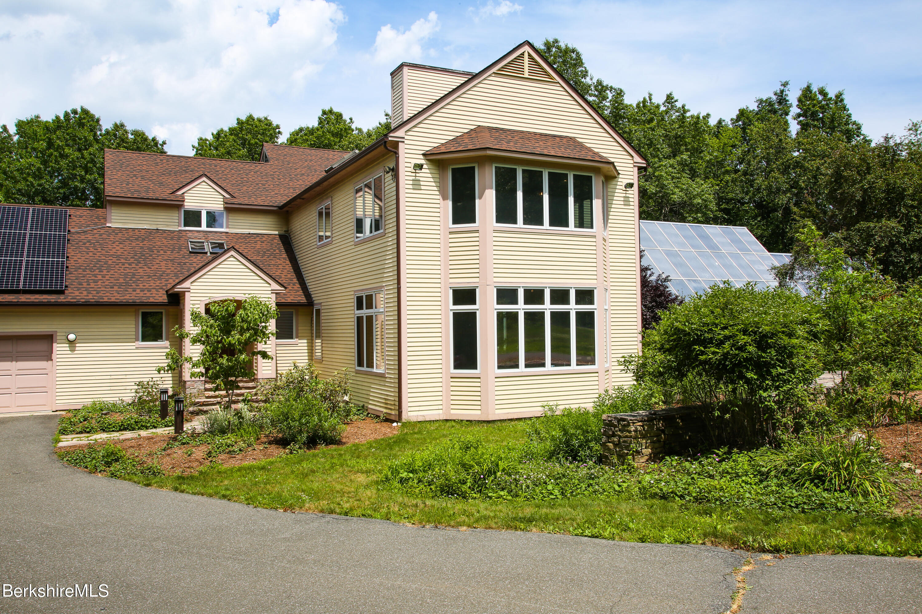 16 High Meadow Road Northampton, MA 01062 - Photo 46 of 49 a front view of a house with a yard