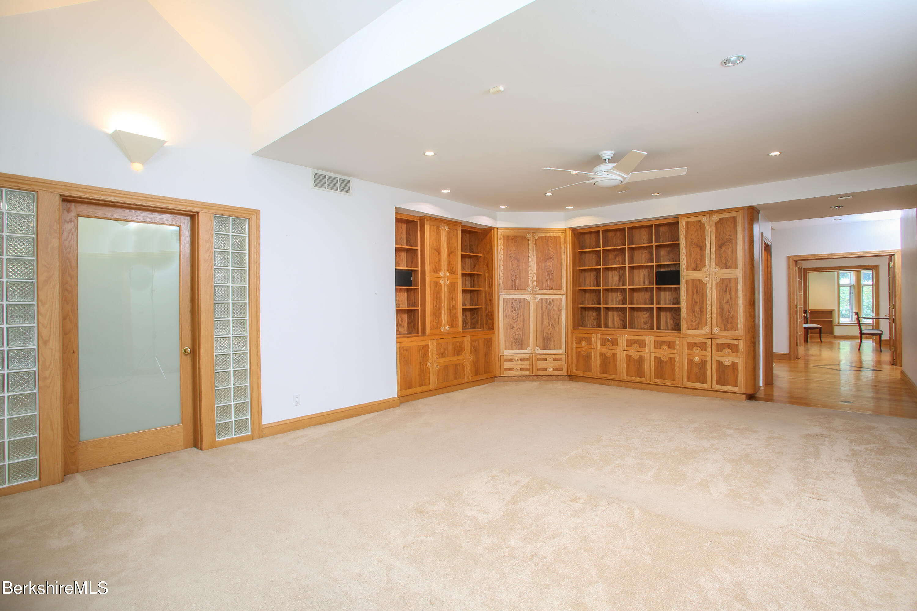 16 High Meadow Road Northampton, MA 01062 - Photo 6 of 49 an empty room with wooden floor and natural light