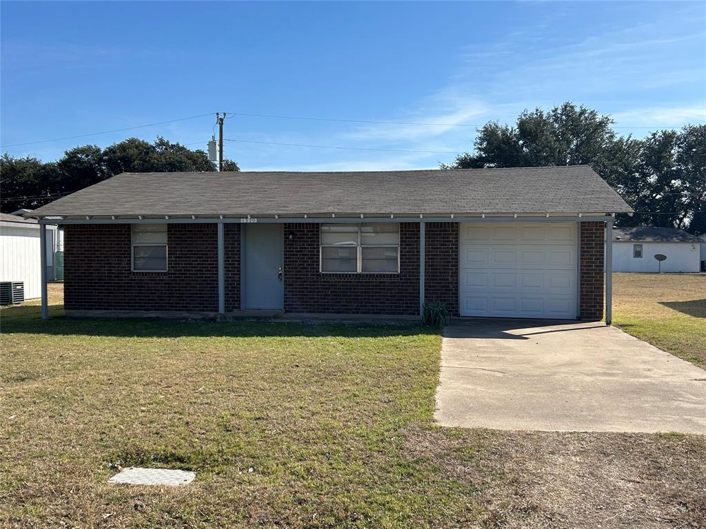 a front view of a house with yard