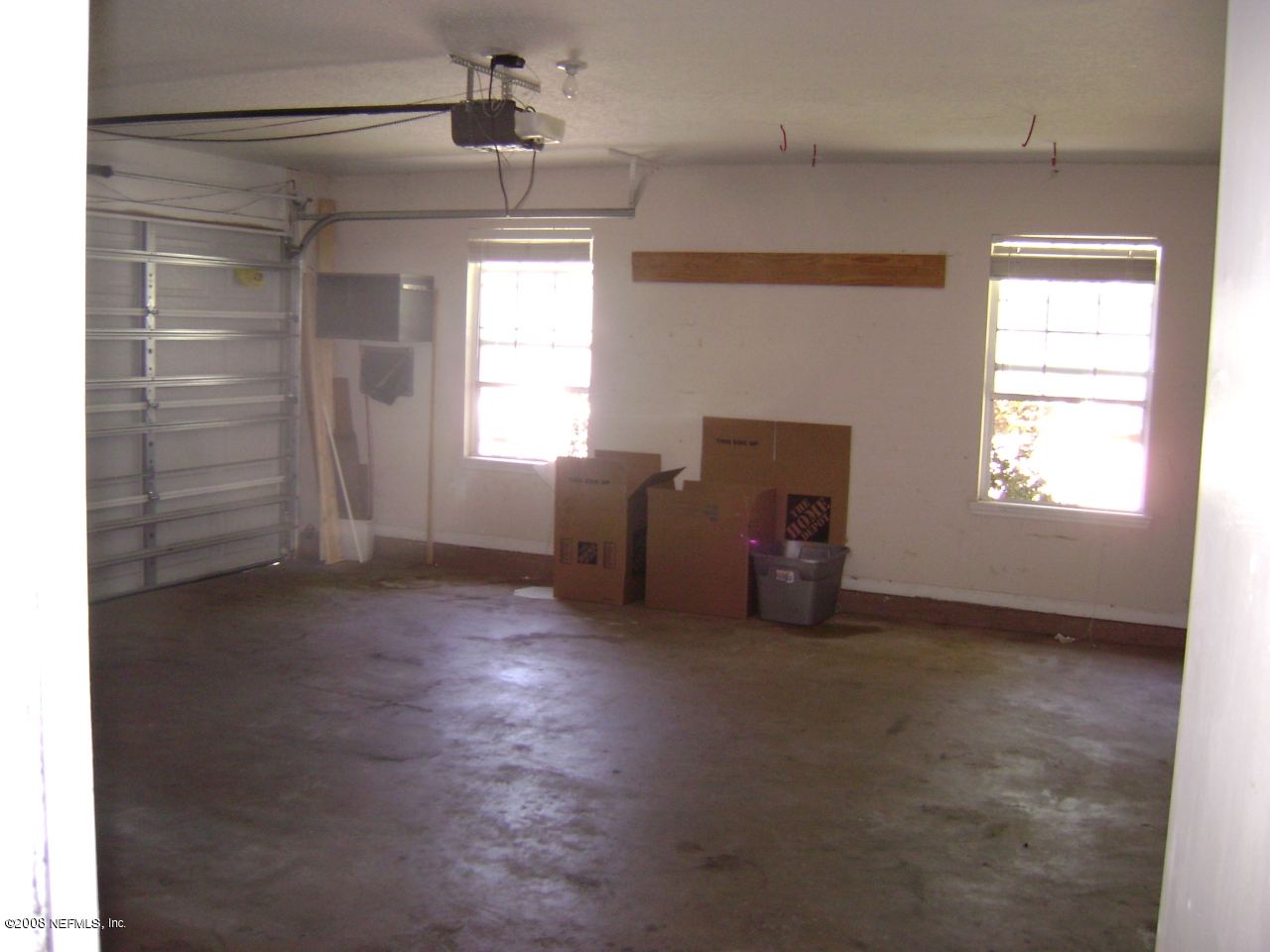 2451 Mallory Hills Road Jacksonville, FL 32221 - Photo 11 of 11 an empty room with windows and cabinet