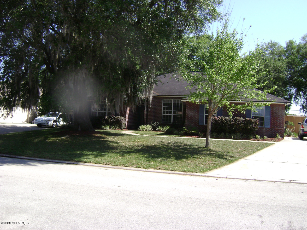 2451 Mallory Hills Road Jacksonville, FL 32221 - Photo 3 of 11 a front view of a house with a yard