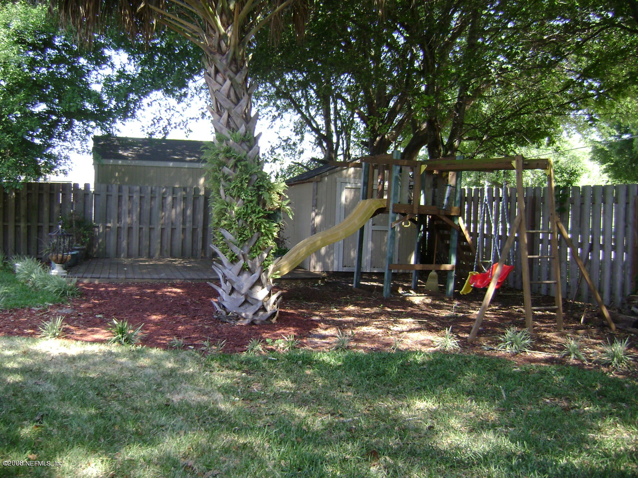 2451 Mallory Hills Road Jacksonville, FL 32221 - Photo 10 of 11 a view of a backyard with a tree