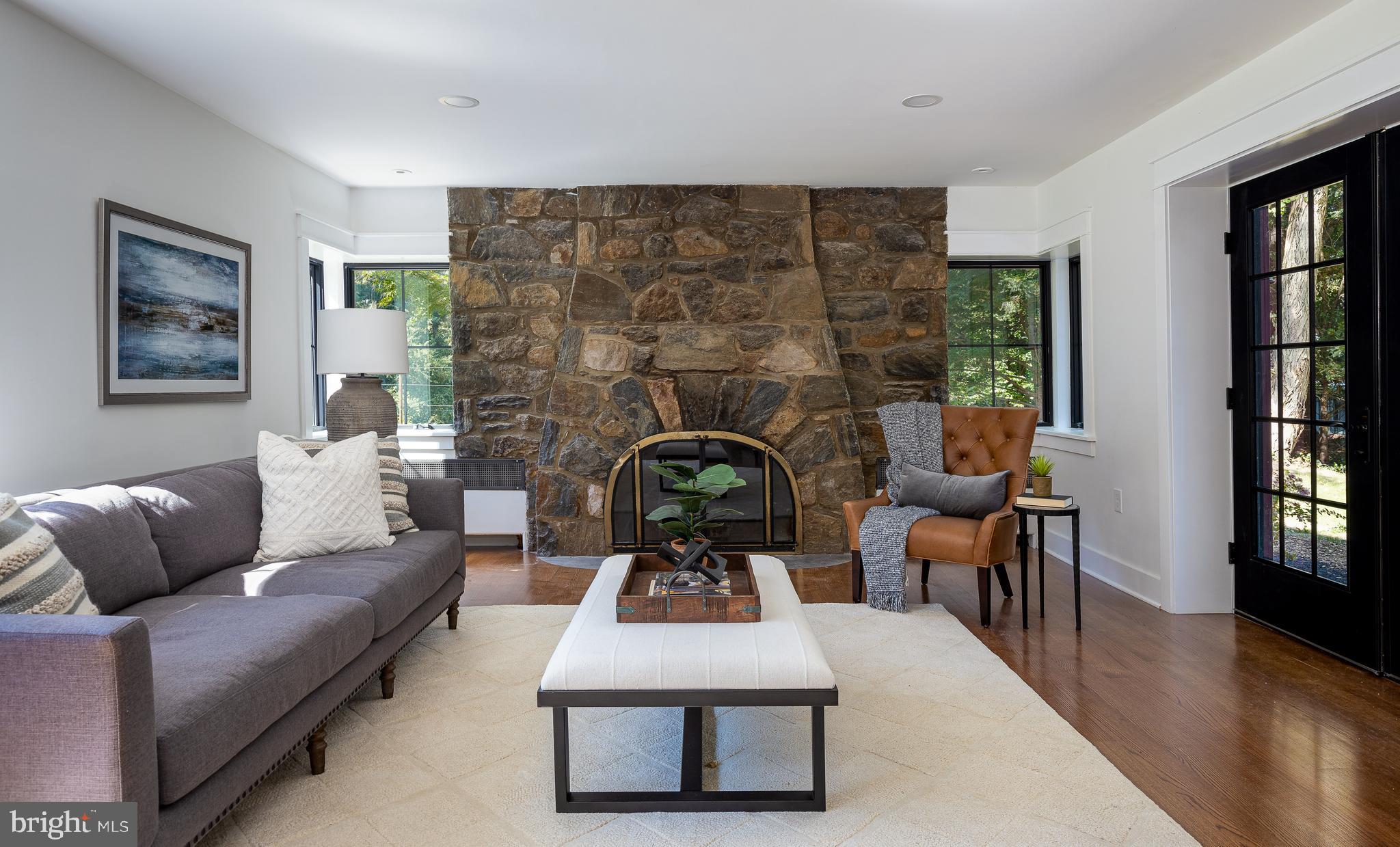 8 Hilltop Road Rose Valley, PA 19086 - Photo 6 of 51 Living room with French doors to patio and gas FP