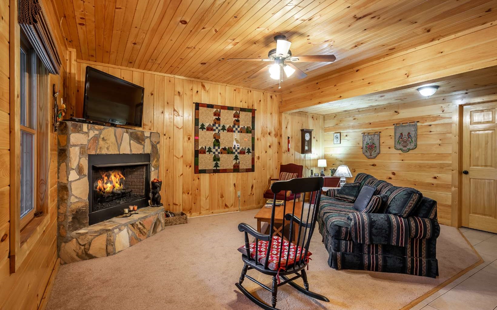 282 Papa Bear Path Cherry Log, GA 30522 - Photo 23 of 33 a living room with furniture a flat screen tv and a fireplace