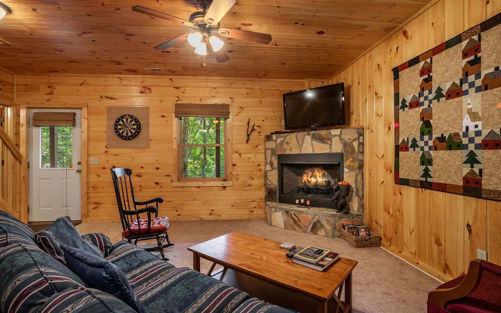 282 Papa Bear Path Cherry Log, GA 30522 - Photo 24 of 33 a living room with furniture a flat screen tv and a fireplace
