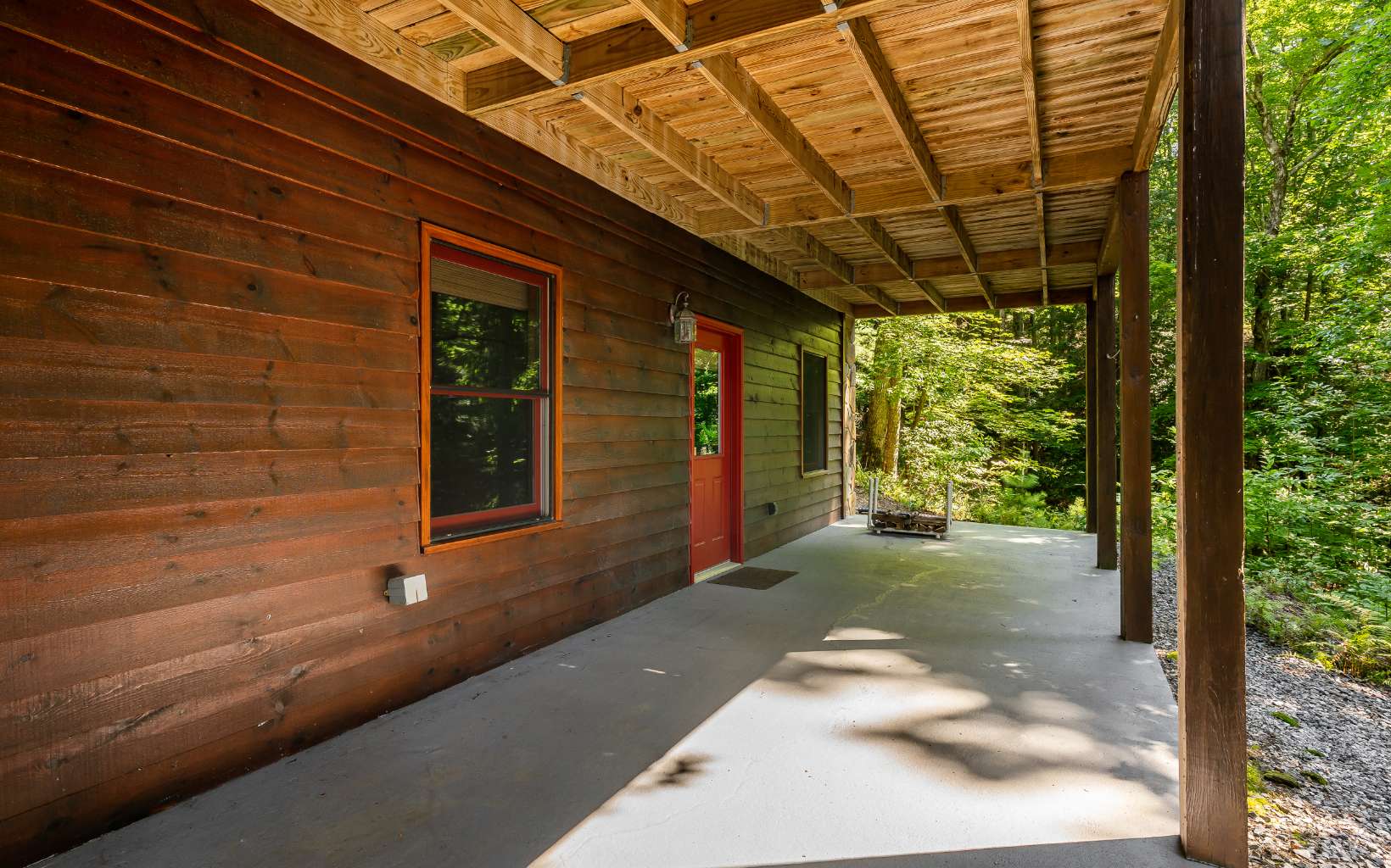 282 Papa Bear Path Cherry Log, GA 30522 - Photo 28 of 33 a view of a porch with a table and chairs next to a window