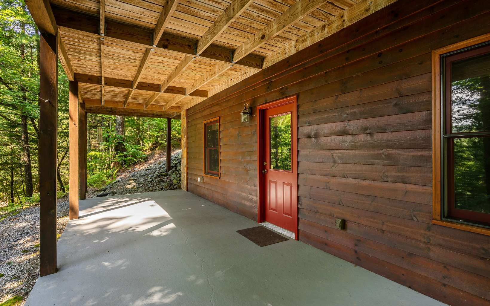282 Papa Bear Path Cherry Log, GA 30522 - Photo 29 of 33 a view of a porch with a table and chairs