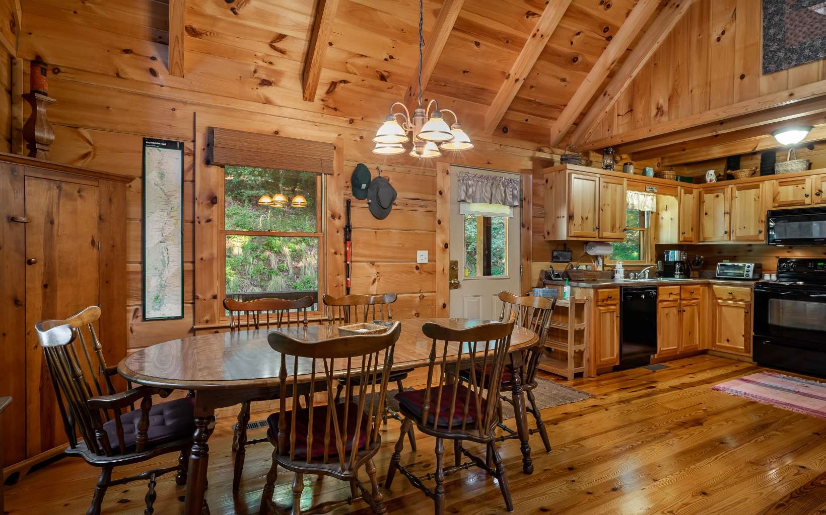 282 Papa Bear Path Cherry Log, GA 30522 - Photo 3 of 33 a kitchen with a dining table chairs and sink