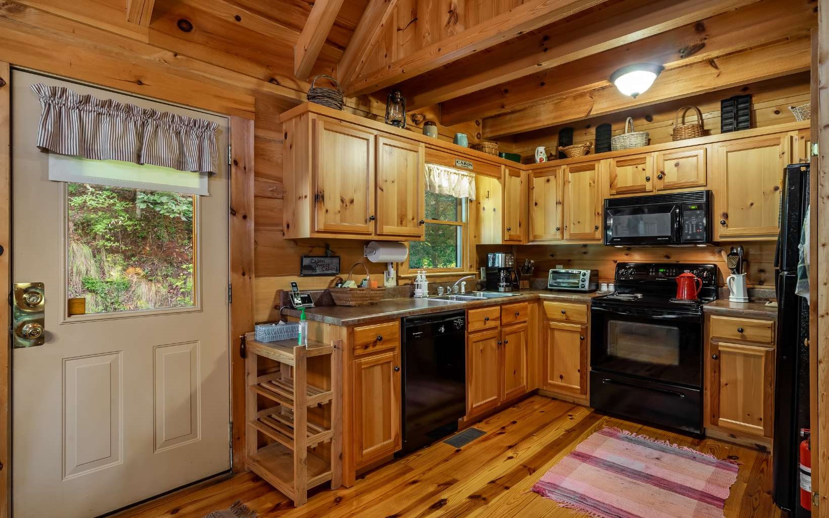 282 Papa Bear Path Cherry Log, GA 30522 - Photo 4 of 33 a kitchen with stainless steel appliances a stove a sink and a refrigerator