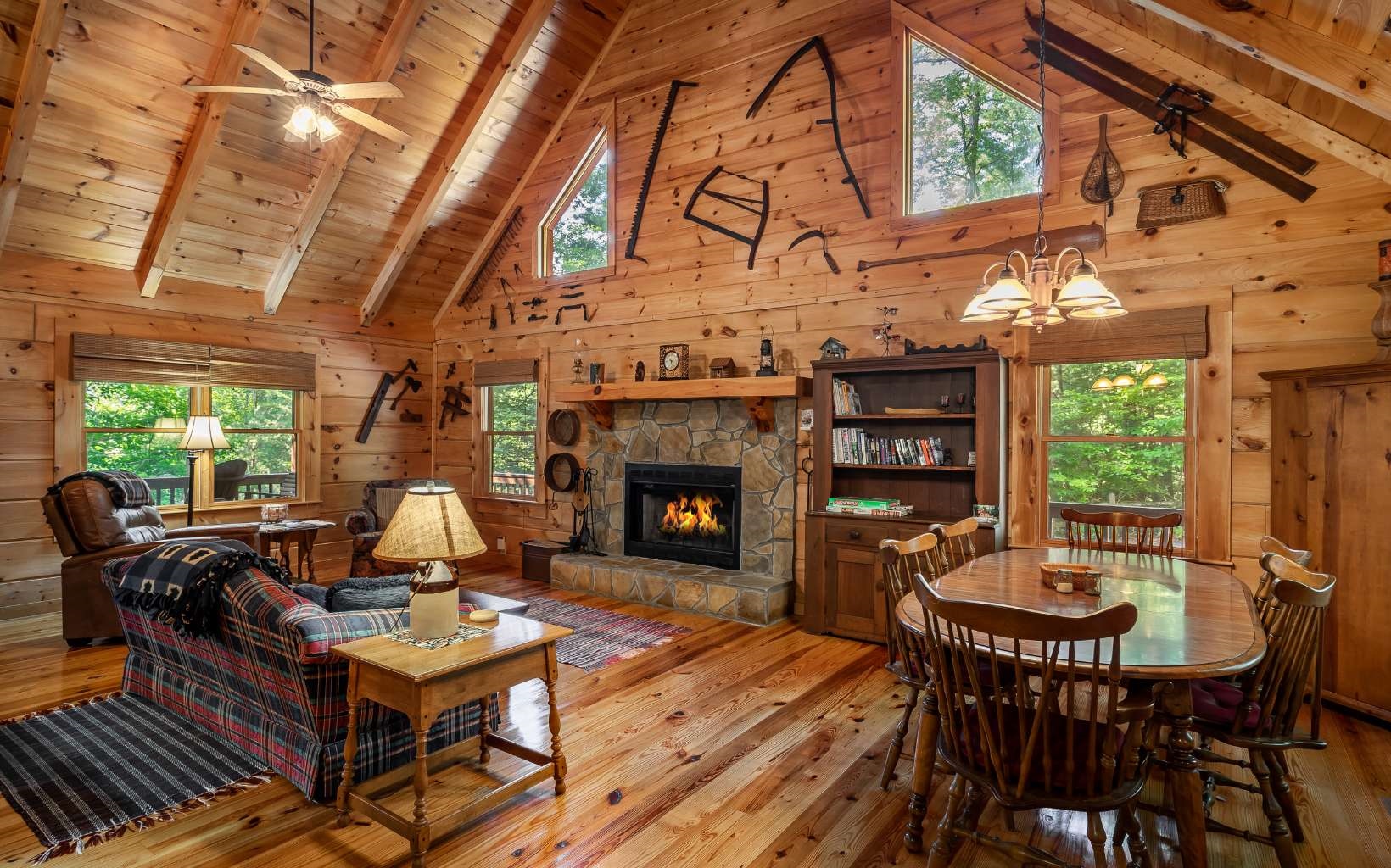 282 Papa Bear Path Cherry Log, GA 30522 - Photo 6 of 33 a living room with furniture a fireplace and a large window