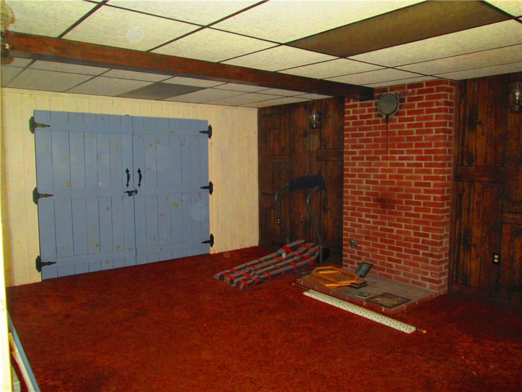 326 Evans Road Zelienople, PA 16063 - Photo 17 of 19 Game room with massive storage closet and prepped for wood burner