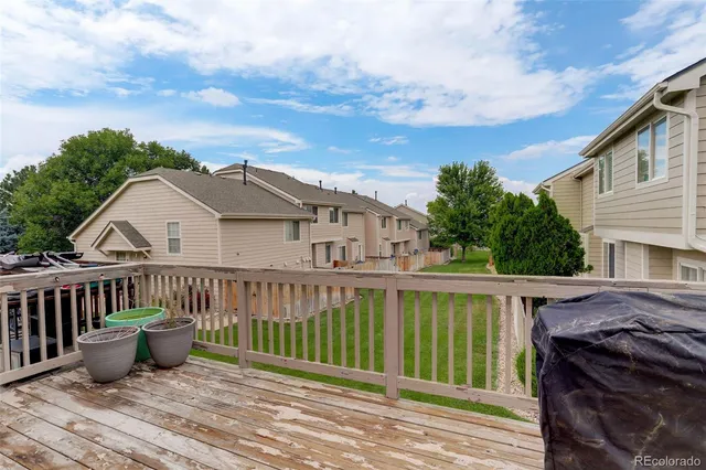a view of a house with wooden deck