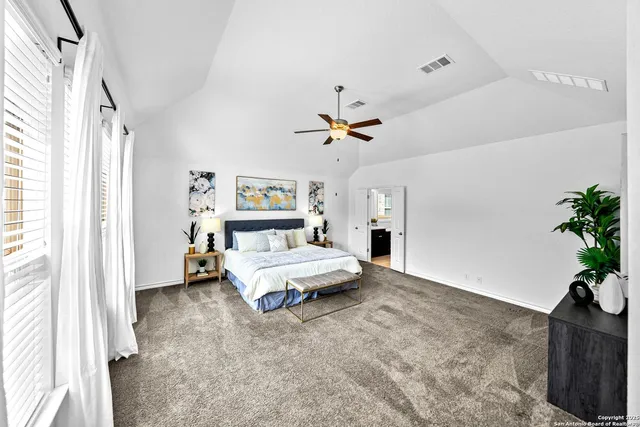 a bed room with a bed and a chandelier