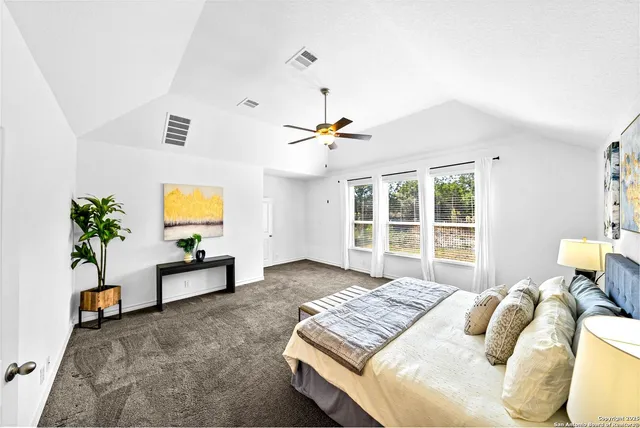 a view of a large living room with wooden floor and furniture