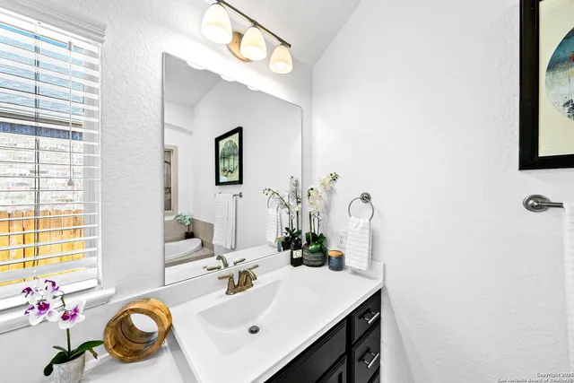 a white bath tub sitting in a bathroom