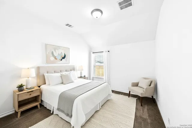 a bathroom with a toilet and shower