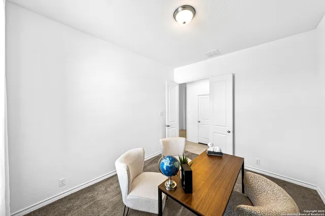 a bedroom with a bed and a chair