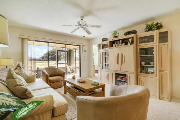 a living room with furniture fireplace and flat screen tv