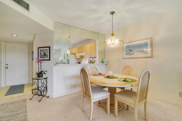 a dining room with furniture and window