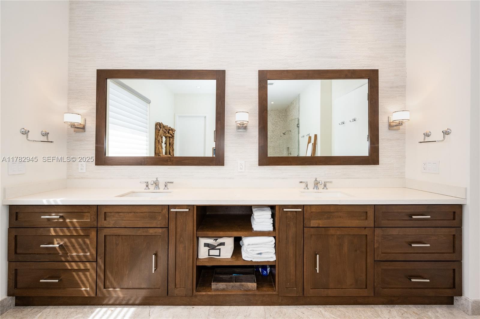 31 Island Drive Key Biscayne, FL 33149 - Photo 22 of 26 a bathroom with a sink and a mirror